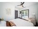 Bright bedroom featuring a queen bed, french doors and a cozy chair at 2536 Burlington N Ave, St Petersburg, FL 33713