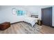 Cozy bedroom with hardwood floors, decor and natural light at 2536 Burlington N Ave, St Petersburg, FL 33713
