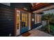 Charming home with a blue front door, copper accents, and a 'Welcome' mat on the tiled front porch at 2536 Burlington N Ave, St Petersburg, FL 33713