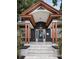 Inviting home with a striking blue door, elegant copper accents, and manicured front yard landscaping at 2536 Burlington N Ave, St Petersburg, FL 33713