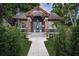 Charming home featuring a blue door, copper accents, and a well-manicured walkway and landscaping at 2536 Burlington N Ave, St Petersburg, FL 33713