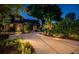 Stunning home exterior at twilight, with manicured landscaping and a long driveway at 2536 Burlington N Ave, St Petersburg, FL 33713