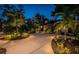 Stunning home exterior at twilight, with manicured landscaping and a circular driveway at 2536 Burlington N Ave, St Petersburg, FL 33713