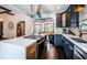 Modern kitchen featuring stainless steel appliances, large island, dark cabinets, and stylish countertops at 2536 Burlington N Ave, St Petersburg, FL 33713