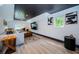 Living room area featuring a large sectional, wood floors and natural light at 2536 Burlington N Ave, St Petersburg, FL 33713
