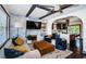 Cozy living room with hardwood floors, fireplace, and an open concept leading into the kitchen and dining area at 2536 Burlington N Ave, St Petersburg, FL 33713