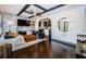 Stylish living room featuring hardwood floors, modern fireplace, and an open layout connected to the kitchen at 2536 Burlington N Ave, St Petersburg, FL 33713