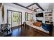 Bright living room with hardwood floors, fireplace, and large windows offering plenty of natural light at 2536 Burlington N Ave, St Petersburg, FL 33713
