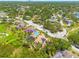 Aerial view of a home with solar panels showcasing proximity to a road and other neighborhood features at 2613 59Th S St, Gulfport, FL 33707