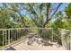 Balcony overlooking lush greenery with comfortable seating for outdoor relaxation at 2613 59Th S St, Gulfport, FL 33707