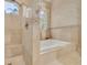 Bathroom showcases a soaking tub with tiled walls and a window for natural light at 2613 59Th S St, Gulfport, FL 33707