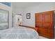 Bright bedroom featuring neutral walls, closet, door to hallway and wooden furnishings at 2613 59Th S St, Gulfport, FL 33707
