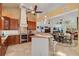 Open kitchen overlooking the dining and living area, with wood cabinets and breakfast bar seating at 2613 59Th S St, Gulfport, FL 33707