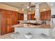 Gourmet kitchen with granite countertops, custom wood cabinetry, and stainless steel appliances at 2613 59Th S St, Gulfport, FL 33707