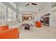 Spacious living room with high ceilings, large windows, and stylish furnishings with access to the kitchen at 2613 59Th S St, Gulfport, FL 33707