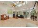 Bright living room features tile floors, skylights, ceiling fans, and access to the outdoor deck at 2613 59Th S St, Gulfport, FL 33707