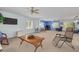Spacious living room featuring multiple seating areas and natural light from large windows at 2613 59Th S St, Gulfport, FL 33707