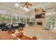 Bright living room with a fireplace, large windows, tile floor, and comfortable seating at 2613 59Th S St, Gulfport, FL 33707