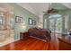 Comfortable main bedroom offering hardwood floors, natural light, and en-suite bathroom access at 2613 59Th S St, Gulfport, FL 33707