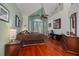 Spacious main bedroom featuring hardwood floors, a tray ceiling, and a balcony at 2613 59Th S St, Gulfport, FL 33707
