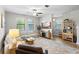 Bright living room with neutral tones, modern furnishings, and wood flooring, creating a welcoming atmosphere at 28638 Tranquil Lake Cir, Wesley Chapel, FL 33543