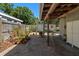 Serene brick patio with potted plants creating a tranquil outdoor living space with a shed at 2903 W Paxton Ave, Tampa, FL 33611