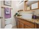 Bathroom with a vessel sink, granite counters, and wooden vanity at 2903 W Paxton Ave, Tampa, FL 33611