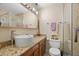 Updated bathroom with a walk-in shower, updated vanity and a toilet at 2903 W Paxton Ave, Tampa, FL 33611