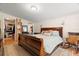 This bedroom features a large wooden bed frame and rocking chair, with a walk-in closet to the side at 2903 W Paxton Ave, Tampa, FL 33611