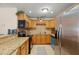 Well-equipped kitchen featuring granite counters, stainless steel appliances, tile backsplash and ample cabinetry at 2903 W Paxton Ave, Tampa, FL 33611