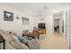 Cozy living room featuring a ceiling fan, tile flooring, and a comfortable sofa at 2903 W Paxton Ave, Tampa, FL 33611