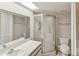 Modern bathroom features a glass-door shower and sleek white vanity at 3203 Green Dolphin St, Tarpon Springs, FL 34689