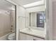 Bright bathroom featuring a skylight and a combined shower and tub at 3203 Green Dolphin St, Tarpon Springs, FL 34689