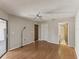 Bright bedroom featuring sleek hardwood floors and access to the bathroom at 3203 Green Dolphin St, Tarpon Springs, FL 34689