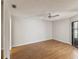Spacious bedroom features sleek hardwood floors and a modern ceiling fan at 3203 Green Dolphin St, Tarpon Springs, FL 34689