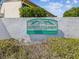 Community sign for Green Dolphin Villas - Garden & Golf Course Condominiums, a 55+ community at 3203 Green Dolphin St, Tarpon Springs, FL 34689