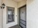 Close-up showcasing the front door with decorative anchor and small window, enhancing the home's entrance at 3203 Green Dolphin St, Tarpon Springs, FL 34689