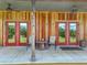 Charming front porch with seating and views of the lush landscape at 35657 Ashley Ln, Dade City, FL 33523