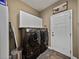 Efficient laundry room with front-load washer and dryer and ample storage cabinets at 35657 Ashley Ln, Dade City, FL 33523