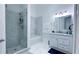 Modern bathroom featuring a marble tiled shower, a glass door, a tub and a vanity at 3605 W Anderson Ave, Tampa, FL 33611