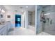 Contemporary bathroom featuring a double vanity and glass-enclosed shower with marble tiling at 3605 W Anderson Ave, Tampa, FL 33611