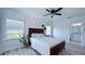 Bright bedroom with hardwood floors, white walls, natural light, and a view of nature at 3605 W Anderson Ave, Tampa, FL 33611