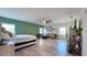 Expansive bedroom area with a large layout including living space and stylish green accent wall at 3605 W Anderson Ave, Tampa, FL 33611