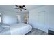 Bright bedroom with a ceiling fan, white walls, and closet space, offering a serene retreat at 3605 W Anderson Ave, Tampa, FL 33611