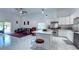 Open floor plan featuring a kitchen with marble island connecting to the living area at 3605 W Anderson Ave, Tampa, FL 33611