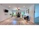 Bright living room with desk, plants, and natural light is a perfect workspace at 3605 W Anderson Ave, Tampa, FL 33611