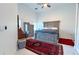 Airy main bedroom with a large rug, neutral furniture, and bright lighting at 3605 W Anderson Ave, Tampa, FL 33611