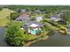 Aerial view of the house with a pool, patio, and pristine lake view creating a private oasis at 4106 Queller Way, Tampa, FL 33618