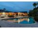 Backyard featuring a pool, patio area, well-maintained landscaping and outdoor seating for entertainment at 4106 Queller Way, Tampa, FL 33618