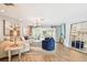 Bright living room featuring hardwood floors, neutral colors, stylish furniture, and plenty of natural light at 4106 Queller Way, Tampa, FL 33618